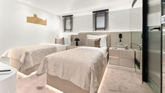 In Split motorsailer charter option Maxita cabin with two single beds for guests visible.