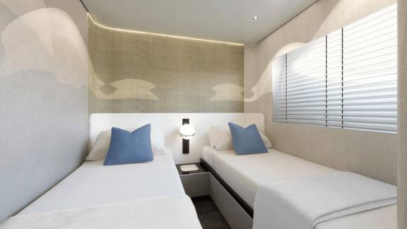 Bright and modern twin bed cabin with blue pillows, ideal for comfortable nights onboard.