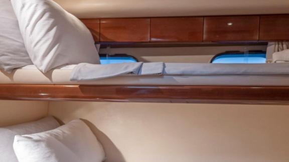 Bunk bed bedroom on the River S motor yacht offers a comfortable sleeping area.
