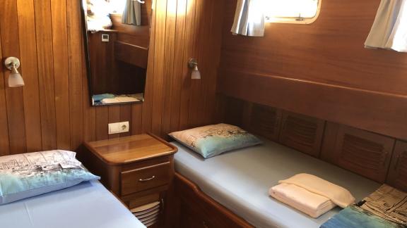 The Enderim A twin cabin has wooden panelling and cosy beds.