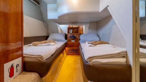 Cozy and comfortable guest cabin of motor yacht Blue My Story.