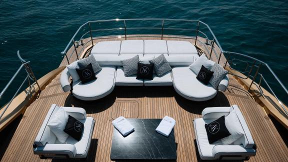 Enjoy a luxurious outdoor seating experience on Ak Royalty with Dubai luxury yacht rentals.