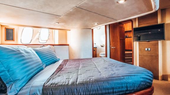 Comfortable space with large window, TV, and a private bathroom.