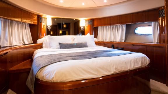 The master bedroom of the yacht Azure offers a large and comfortable bed for luxurious accommodation.