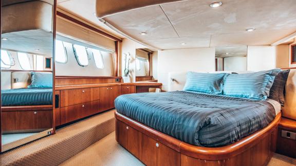 Features a large bed, mirror, and plenty of storage for a relaxing stay.