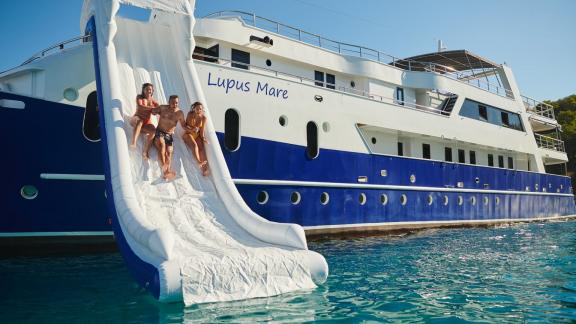 Action and joy on the water slide of the 43m motor yacht Lupus Mare in Croatia.