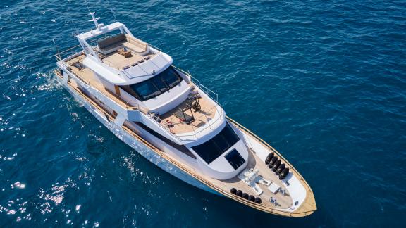 The luxury motor yacht Wide Liberty on the open sea from an aerial view.