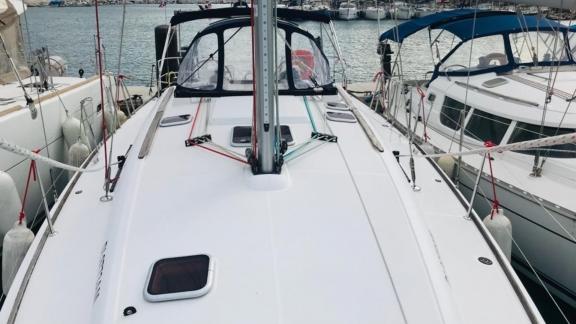 Foredeck of sailing yacht Winter Breeze, anchored in the marina.