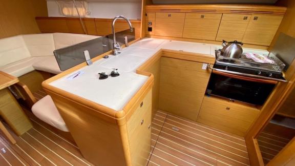 The kitchen of the sailing yacht Winter Breeze offers a comfortable dining area equipped with modern appliances.