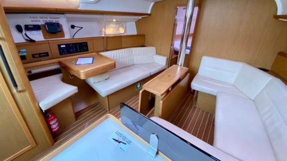 The interior salon of the sailing yacht Winter Breeze features comfortable seating areas for guests.