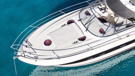 Aegean Blue features a foredeck sunbathing area for daily motor yacht charters in Mykonos.