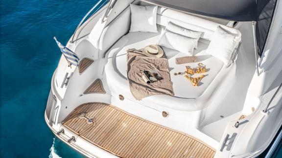 Aegean Blue features an aft sunbathing area for daily motor yacht charters and VIP sea trips in Mykonos.