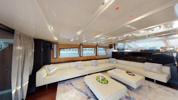 The lounge of Tayget offers luxury and comfort for your Dubai motor yacht rental experience.