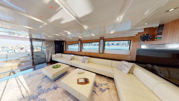 The lounge of Tayget motor yacht offers ample space and luxury for a Dubai daily yacht rental.