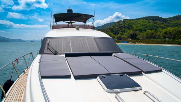 The front deck of Alfa F yacht offers a peaceful atmosphere amidst nature.