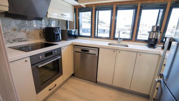 The modern kitchen of Almila motor yacht in Marmaris features fully equipped appliances and spacious countertops.