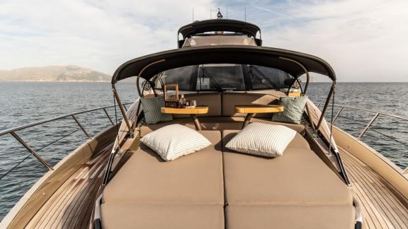 The front deck of the Ammonite motor yacht features a spacious sunbathing area with comfortable cushions.