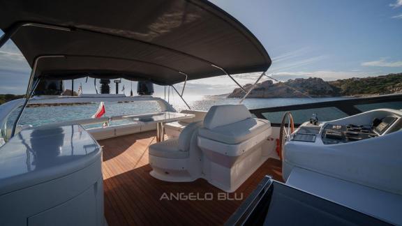 The flybridge area on Angelo Blu offers sea view relaxation and luxury yacht charter in Cannes.