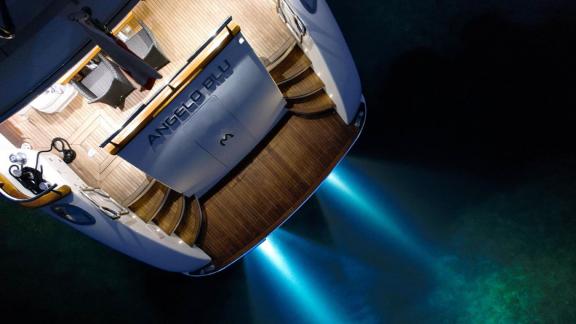 The illuminated swim platform of Angelo Blu enhances the private yacht charter experience in Cannes.