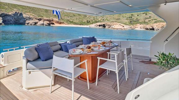 Apeiron Blue in Lavrion features an aft deck dining area with sea views and a luxury charter experience.