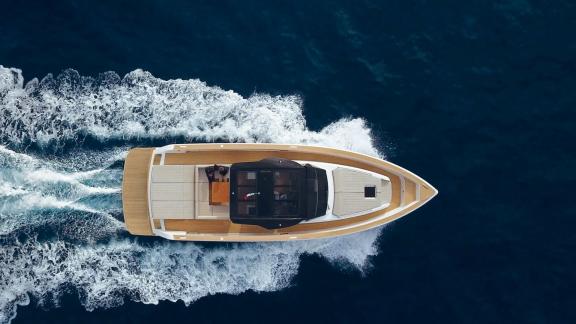 Among Cannes yacht charter options Arlias motor yacht shows deck layout and fast cruising motion.