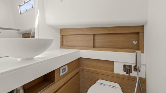 Among Cannes yacht charter options Arlias motor yacht shows bathroom with sink and organized storage.