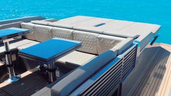 Spacious aft lounging zone of Bambino motor yacht in Ibiza.