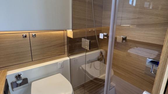 Modern bathroom of the Bambino motor yacht available for rent in Ibiza.