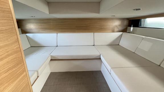 Comfortable salon space of Bambino motor yacht off the coast of Ibiza.