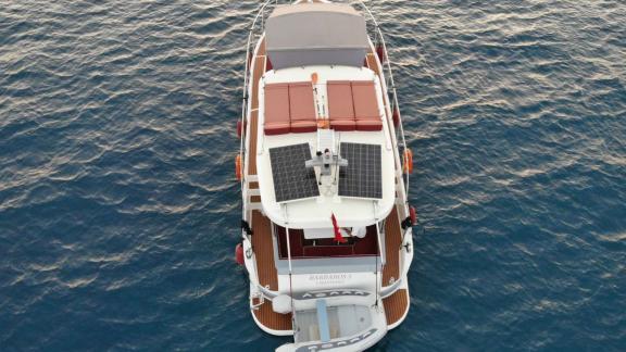 Red cushions and solar panels on upper deck of Barbaros 3 lobster yacht in Marmaris.