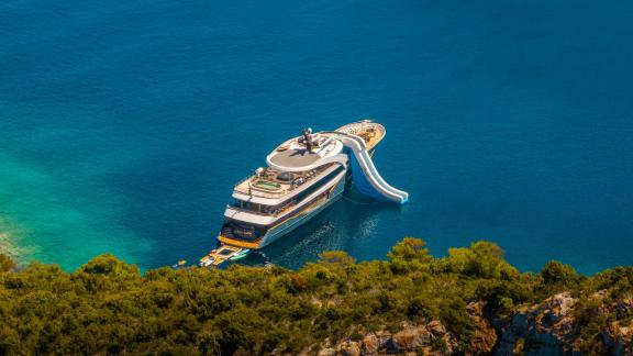 Enjoy the luxury yacht with its own waterslide, perfect for fun and relaxation.