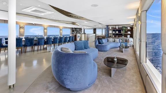 Elegant and spacious interior lounge with panoramic windows on Bella.