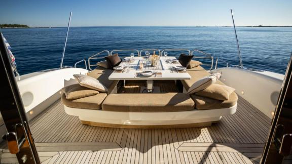 Among Cannes daily yacht rental options Best Mountain aft deck shows dining area with sea view.