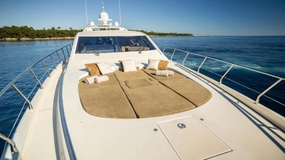 Among Cannes daily yacht rental options Best Mountain front deck shows large sunbathing area with cushions for comfort.