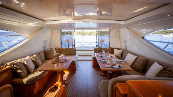 Among Cannes daily yacht rental options Best Mountain interior shows spacious lounge and dining area.