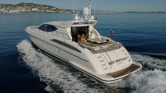 Among Cannes daily yacht rental options Best Mountain is seen from rear cruising smoothly at sea.