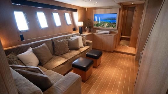 Among Cannes daily yacht rental options Best Mountain interior shows lounge with sofa and TV area.