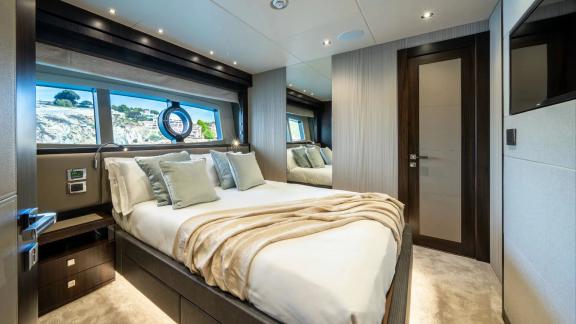 Among Spain yacht charter options Blue Infinity One 5 cabin yacht for 12 guests shows cozy cabin.