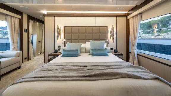 Among Spain yacht charter options Blue Infinity One 5 cabin yacht for 12 guests shows large cabin.