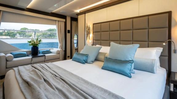 Among Spain yacht charter options Blue Infinity One 5 cabin yacht for 12 guests shows cozy cabin.