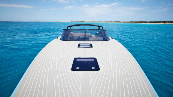 The spacious front deck of the Blue Steel motor yacht offers a view of the sea.