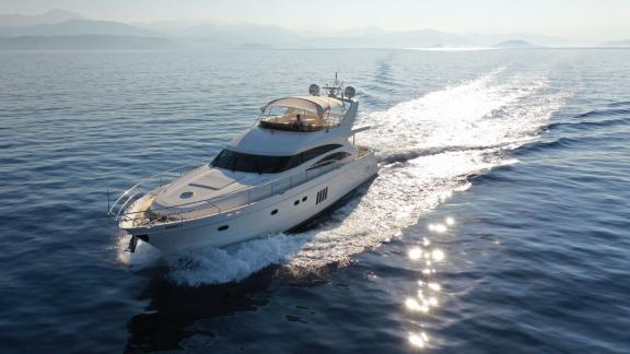 The motor yacht Bormus 2 cruising swiftly on the open sea.