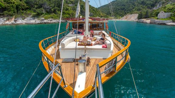 Guests relax on the Gulet Altair, yacht in Split, Croatia, 6 cabins, luxurious sailing holiday in an idyllic bay.