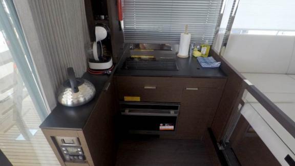 The kitchen on the motor yacht Brigadoon features basic cooking equipment and storage space.