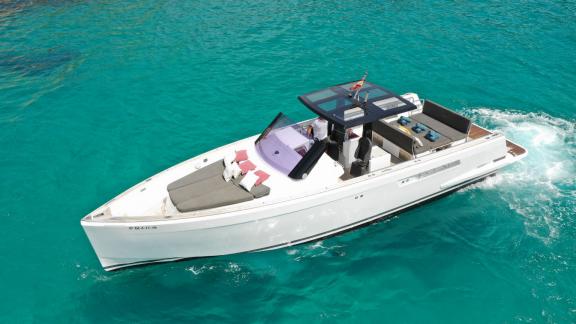 The motor yacht Celebrate offers spacious sunbathing and seating areas, viewed from the side top.