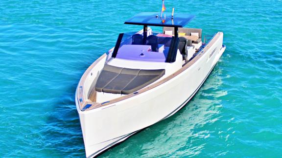 The motor yacht Celebrate with a spacious sunbathing area on the foredeck, viewed from the front top.