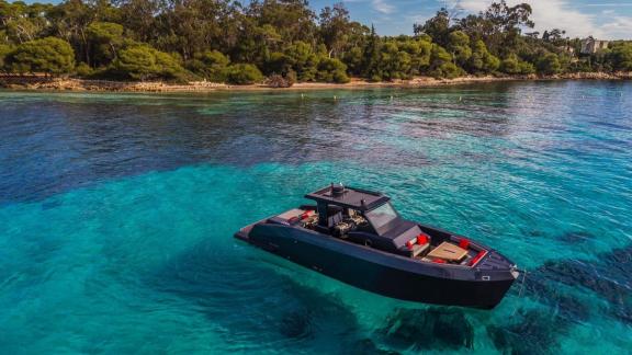 Among Monaco yacht charter options Cest Party motor yacht shows calm anchoring and clear water scenery.