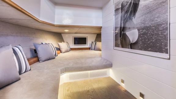 Among Monaco yacht charter options Cest Party motor yacht shows cozy indoor seating and relaxation area.