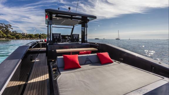 Among Monaco yacht charter options Cest Party motor yacht shows aft deck with large sunbed area.