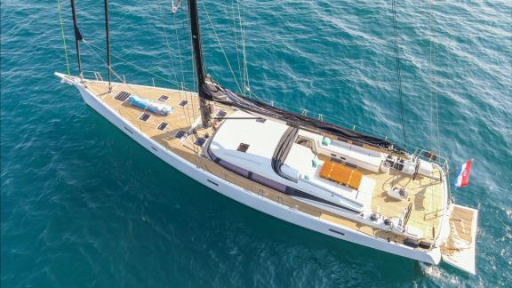 Among sailing yacht rental options in Kastela Bubbles is seen from above showing deck layout and exterior while cruising